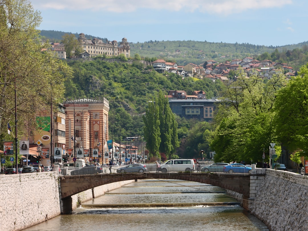 Sniper Tower Sarajevo bullet holes facade Miljacka river view